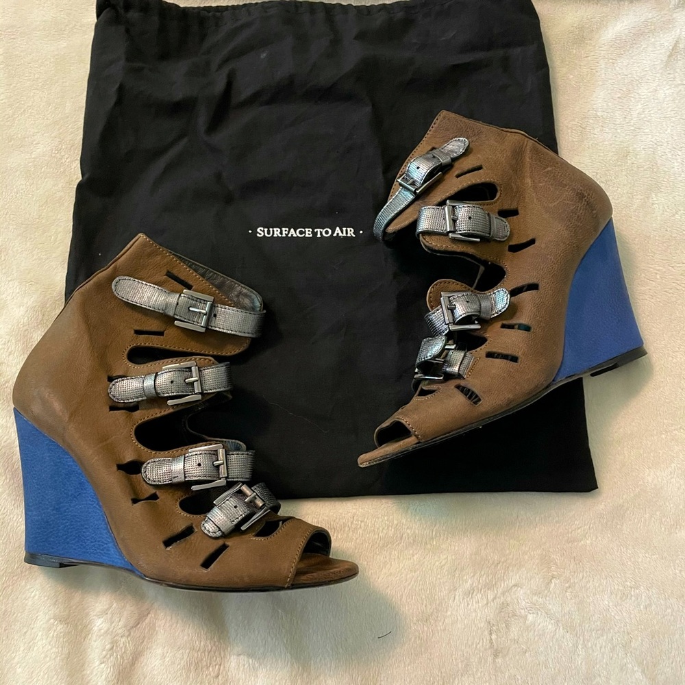 Unique Surface to Air buckle wedge sandals